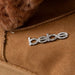 bebe Women's Winter Boot with Faux Fur Trim and Charm Stones