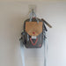 (R)evolution Daily Crossbody